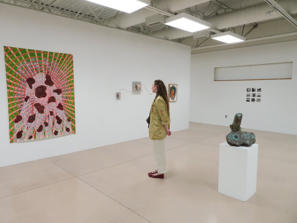 Eleanor McCrary viewing work in a gallery